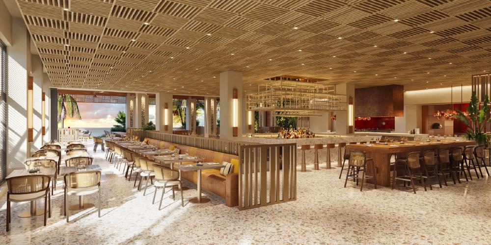 A view of the restaurant at the Grand Hyatt Grand Cayman Residences, with white and gold accents around a central bar