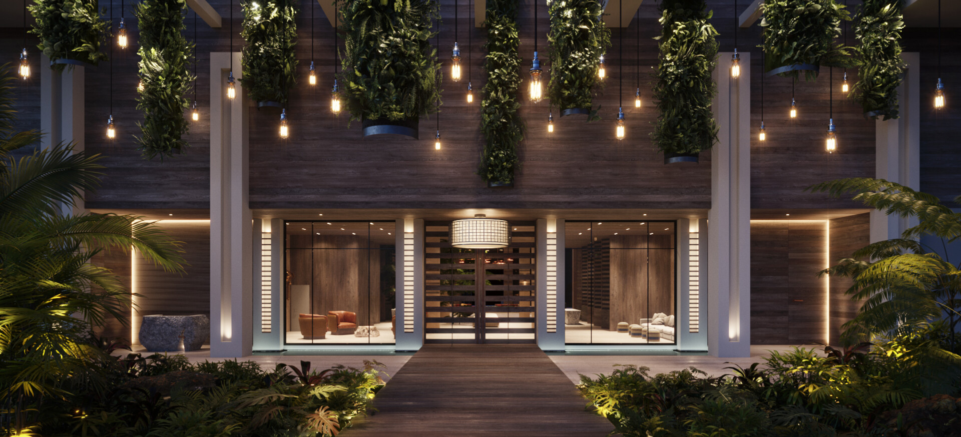 Entryway of Grand Hyatt Grand Cayman residences, ambiently lit and lush with greenery